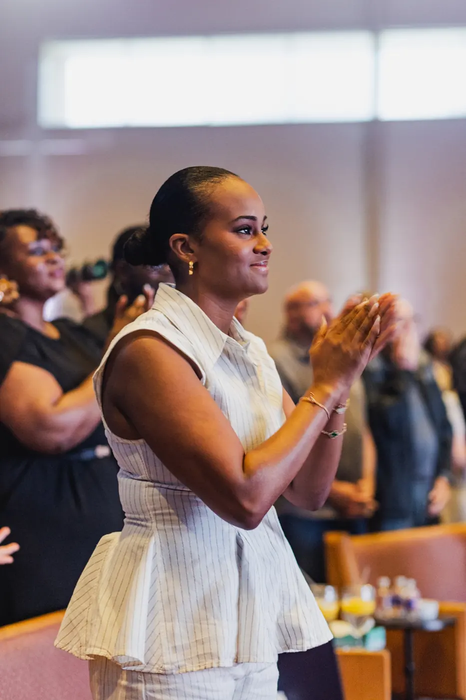 A woman clapping during worship