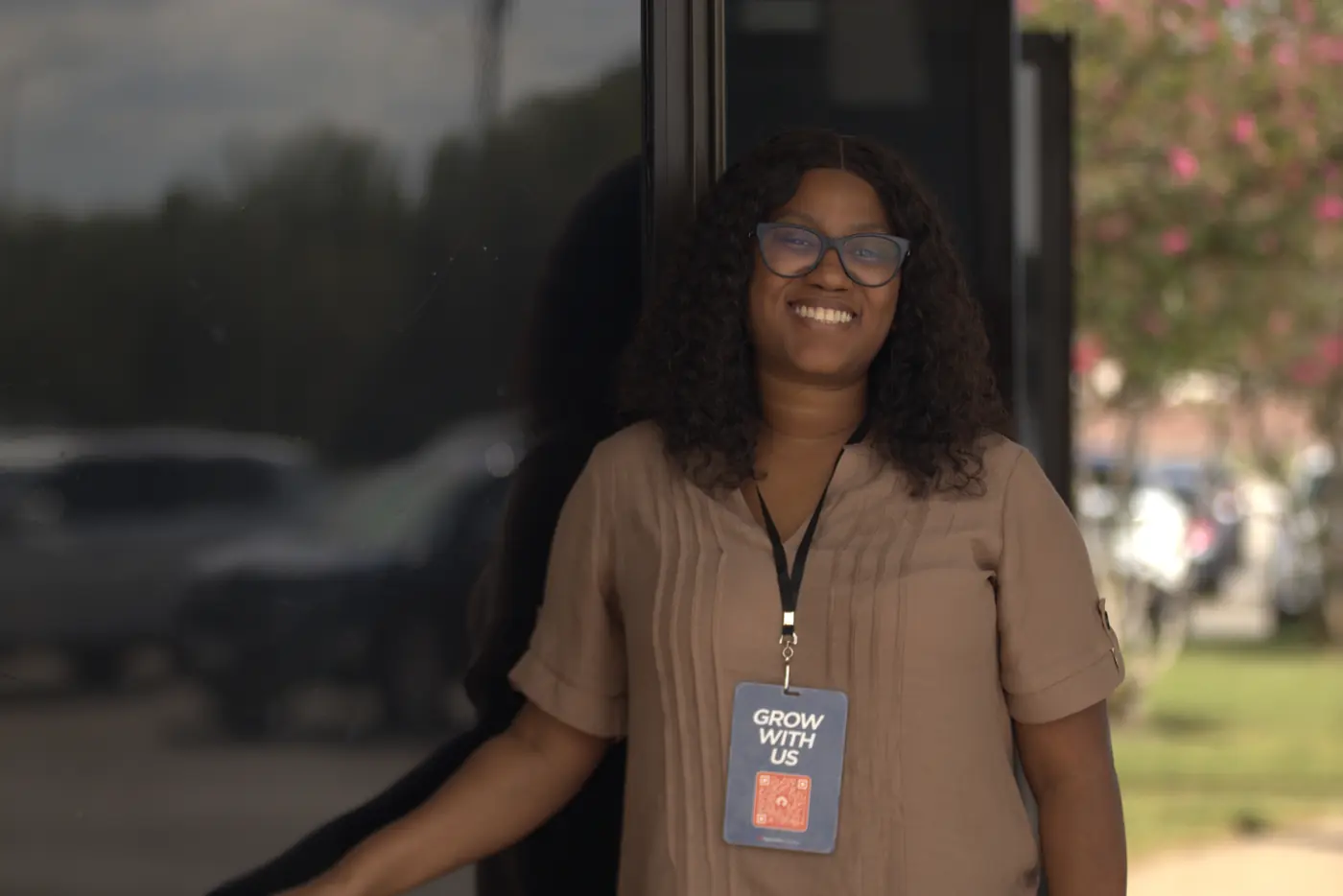 A smiling greeter welcomes people at Rig Church Houston