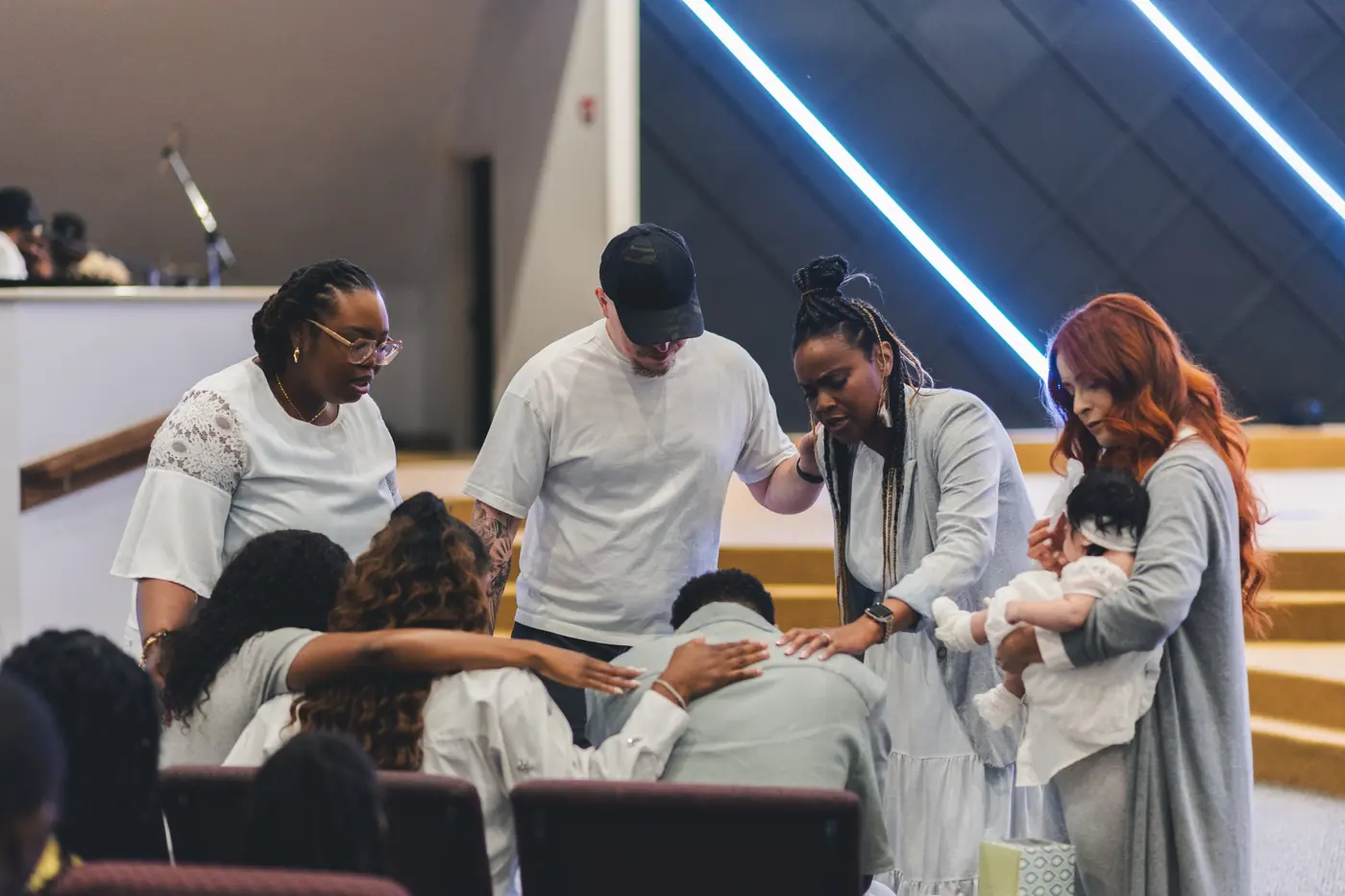 People praying over one another