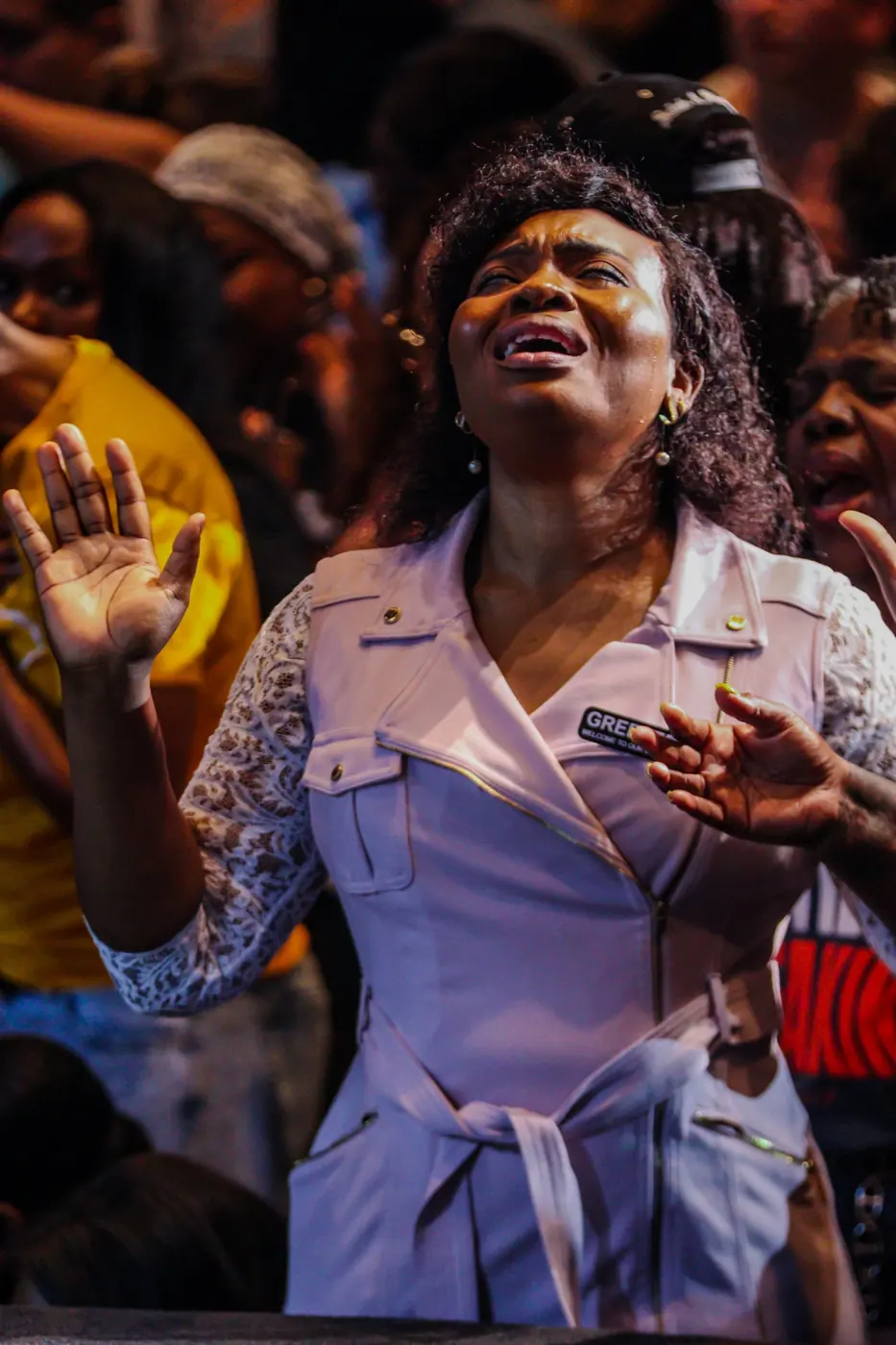 A woman worshipping with tears